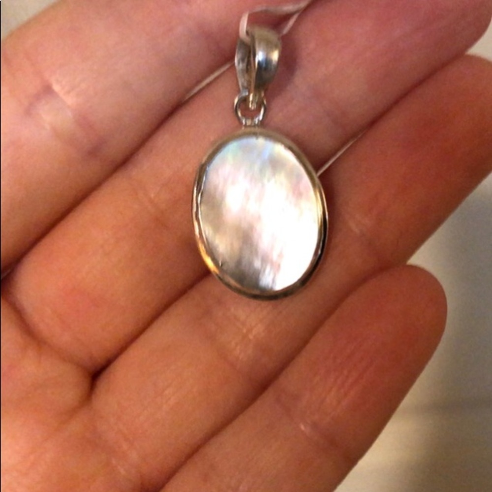 Dainty feminine mother of pearl set in .925 sterling silver pendant